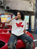 DAXUEN white oversized stylized dove graphic t-shirt — model photo