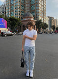 DAXUEN solid grey fitted t-shirt with small graphic — model photo