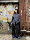 DAXUEN checkered button-up shirt with stylized horse embroidery — model photo