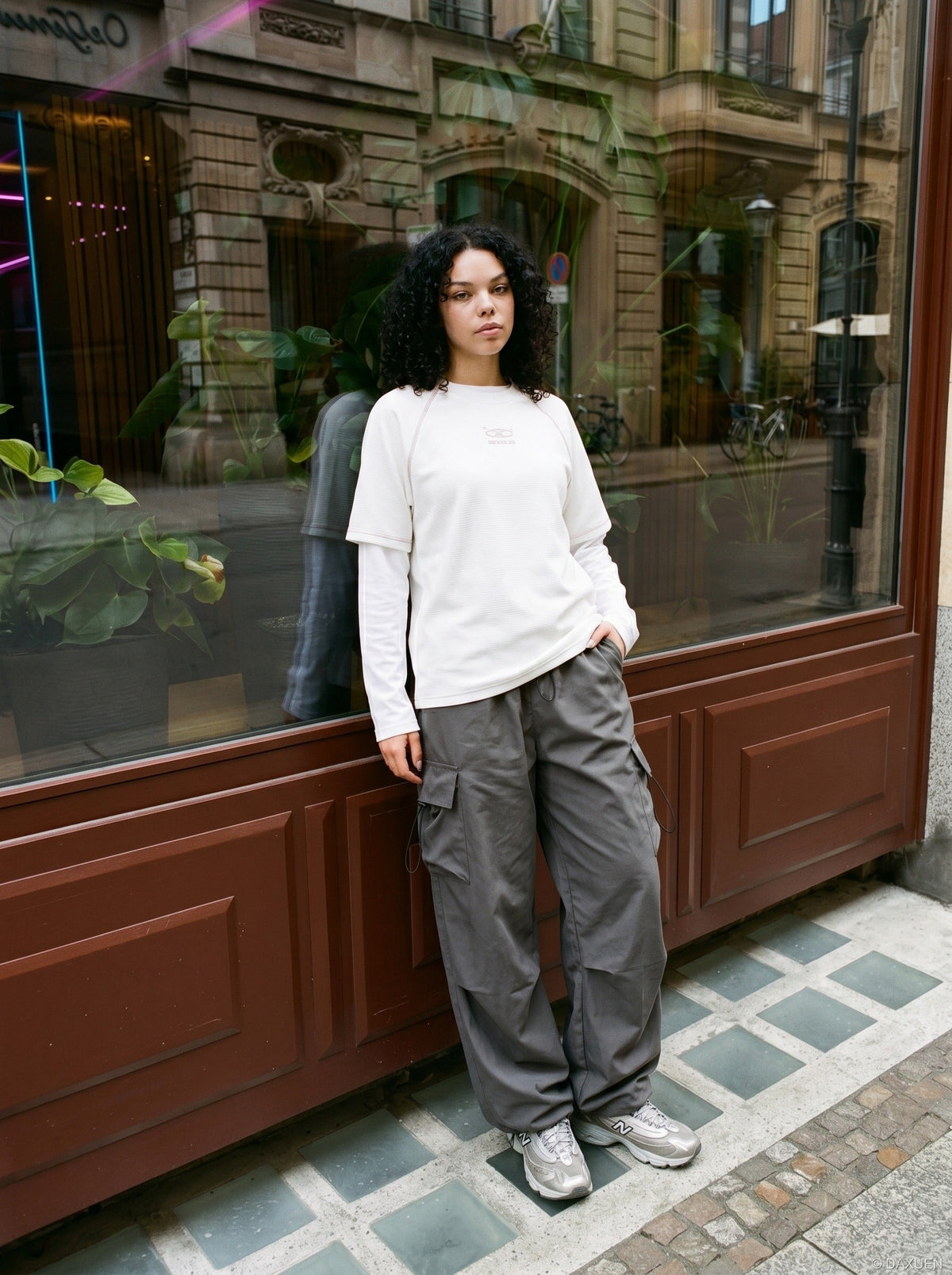 DAXUEN deep maroon stylized oval 'ANSWER ME' graphic tee — model photo
