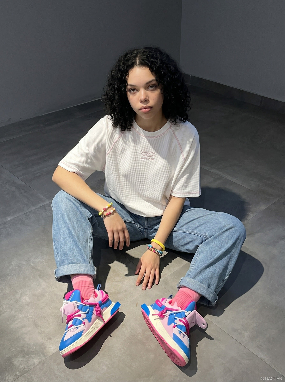 DAXUEN deep maroon stylized oval 'ANSWER ME' graphic tee — model photo