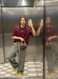 DAXUEN deep maroon stylized oval 'ANSWER ME' graphic tee — model photo