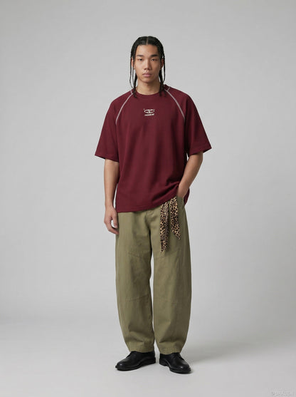 DAXUEN deep maroon stylized oval 'ANSWER ME' graphic tee — model photo