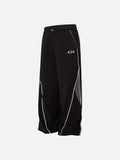 DAXUEN black track pants with stylized oval graphic