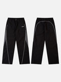 DAXUEN black track pants with stylized oval graphic