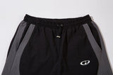 DAXUEN black track pants with stylized oval graphic