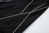 DAXUEN black track pants with stylized oval graphic