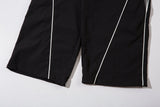 DAXUEN black track pants with stylized oval graphic