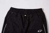 DAXUEN black track pants with stylized oval graphic