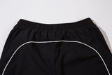 DAXUEN black track pants with stylized oval graphic