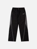 DAXUEN black track pants with stylized oval graphic