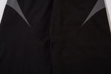 DAXUEN black track pants with stylized oval graphic