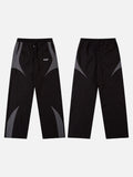 DAXUEN black track pants with stylized oval graphic