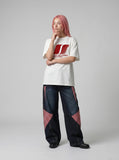 DAXUEN white oversized stylized overlapping S graphic tee — model photo