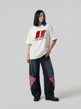 DAXUEN white oversized stylized overlapping S graphic tee — model photo