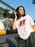 DAXUEN white oversized stylized overlapping S graphic tee — model photo