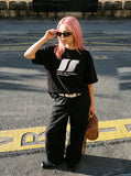 DAXUEN white oversized stylized overlapping S graphic tee — model photo
