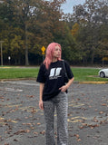 DAXUEN white oversized stylized overlapping S graphic tee — model photo