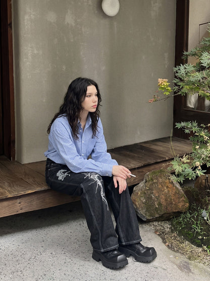 DAXUEN dark wash wide-leg jeans with white animal graphic — model photo