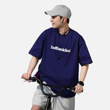 DAXUEN solid color oversized t-shirt with stylized wordmark graphic