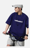 DAXUEN solid color oversized t-shirt with stylized wordmark graphic