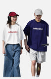 DAXUEN solid color oversized t-shirt with stylized wordmark graphic