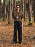 DAXUEN black wide-leg pants with subtle abstract pattern — model photo