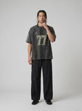 DAXUEN black wide-leg pants with subtle abstract pattern — model photo