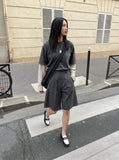 DAXUEN Tailored wide-leg shorts with zipper detail — model photo