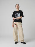 DAXUEN Short-sleeved t-shirt with apple graphic — model photo