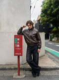 DAXUEN dark brown faux leather bomber jacket — model photo