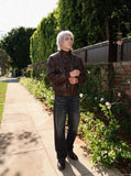 DAXUEN dark brown faux leather bomber jacket — model photo