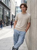 DAXUEN Men's short sleeve knitted sweater with textured knit — model photo