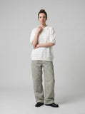 DAXUEN solid white textured open-knit polo shirt — model photo