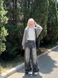 DAXUEN washed black and blue textured quilted wide-leg jeans — model photo