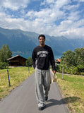 DAXUEN rust brown and black color block sweatshirt with graphic — model photo