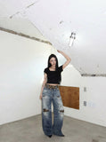 DAXUEN Distressed wide-leg jeans with tiger stripe pattern — model photo