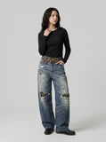DAXUEN Distressed wide-leg jeans with tiger stripe pattern — model photo