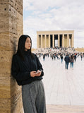 DAXUEN black oversized tonal text track jacket — model photo