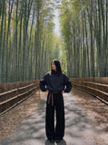 DAXUEN black oversized tonal text track jacket — model photo