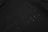 DAXUEN black mock neck top with tone-on-tone graphic