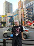 DAXUEN Graphic t-shirt featuring cat and butterfly designs — model photo