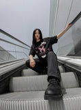 DAXUEN Graphic t-shirt featuring cat and butterfly designs — model photo