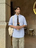 DAXUEN Button-up shirt with puppy graphics and plaid tie — model photo