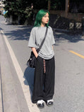DAXUEN Oversized short-sleeve graphic t-shirt in white and grey — model photo