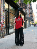 DAXUEN light beige tribal graphic balloon-leg sweatpants — model photo