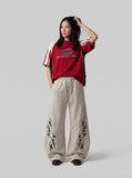 DAXUEN light beige tribal graphic balloon-leg sweatpants — model photo