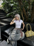 DAXUEN High-waisted wide-leg trousers with trompe l'oeil design — model photo