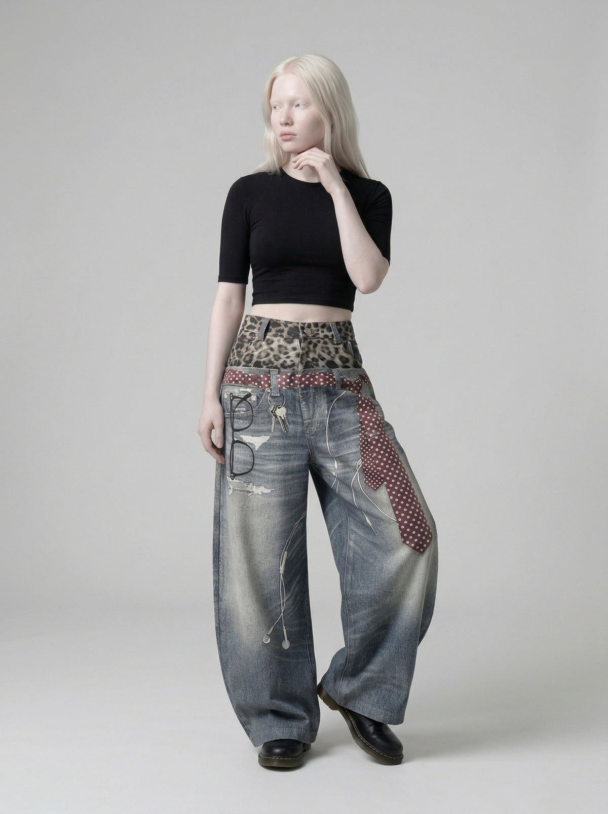 DAXUEN High-waisted wide-leg trousers with trompe l'oeil design — model photo