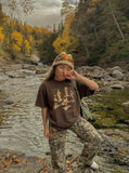 DAXUEN Oversized graphic T-shirt with human figures and text — model photo